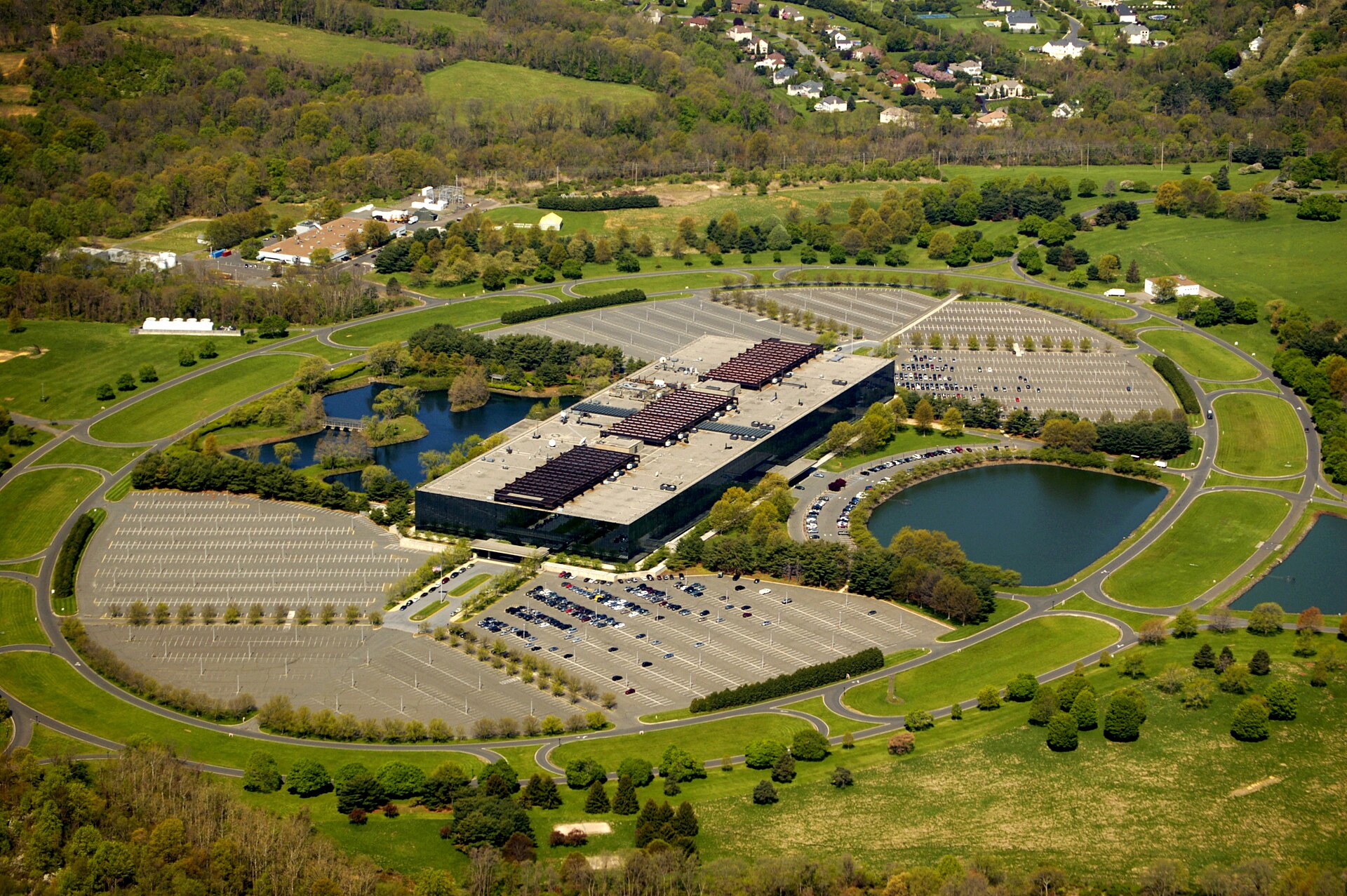 Aerial view of the Eero Saarinen Bell Labs Holmdel research complex surrounded by green lawns